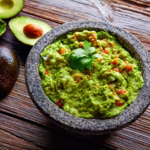 Life-Changing Paleo Guacamole Recipe - This super quick and easy guacamole recipe will quickly become one of your favorite dishes. Be sure to use fresh cilantro and Jalapeno - it's important. | www.amiofbs.com