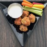 This healthy baked buffalo chicken meatball recipe is savory, spicy and oh so delicious. Serve an appetizer or pile them on top of greens for a satisfying meal. | amiofbs.com