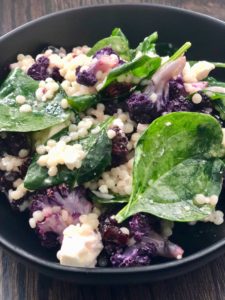 Roasted cauliflower, spinach, couscous, feta and dried cherries create an explosion of taste and texture in this quick, easy and healthy salad recipe. | www.amiofbs.com