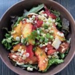 Destined to become your favorite healthy summer salad, this recipe features fresh sweet corn, juicy sweet peaches and tomatoes with a lemon basil vinaigrette. It's Paleo, Whole30, Sugar-Free, Gluten-Free and Vegetarian. | www.amiofbs.com