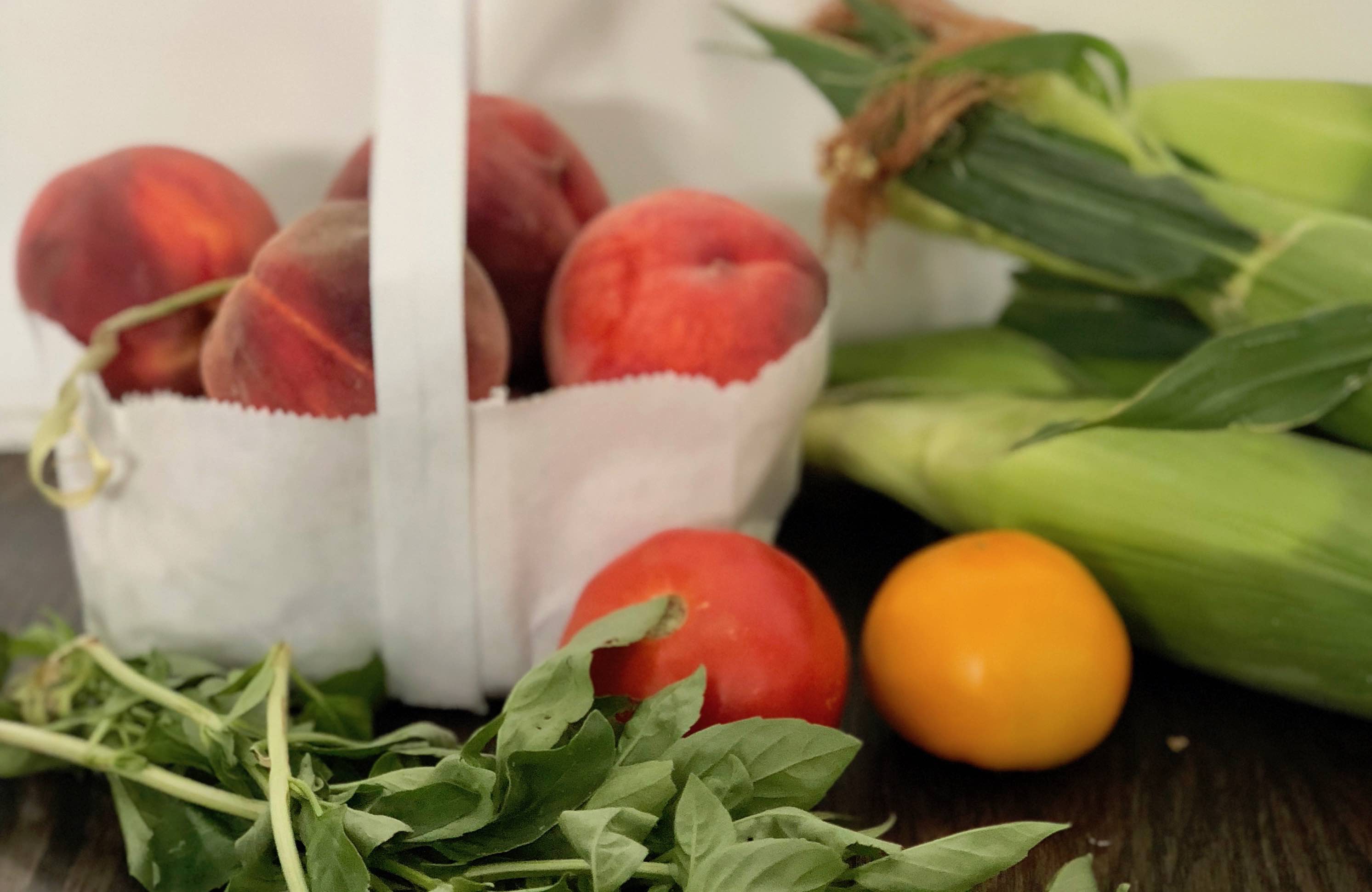 Destined to become your favorite healthy summer salad, this recipe features fresh sweet corn, juicy sweet peaches and tomatoes with a lemon basil vinaigrette. It's Paleo, Whole30, Sugar-Free, Gluten-Free and Vegetarian. | www.amiofbs.com