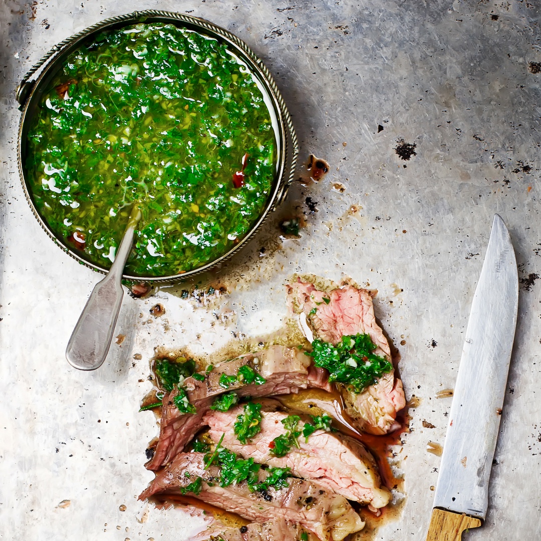Homemade Paleo Chimichurri Sauce is so much more than just a topper for steaks. It's also delicious on chicken, seafood, potatoes, etc. Chock full of fresh herbs and healthy fats, it will add a boost of flavor to all of your meals. And, you can make it in less than 5 minutes. | www.amiofbs.com