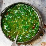 Homemade Paleo Chimichurri Sauce is so much more than just a topper for steaks. It's also delicious on chicken, seafood, potatoes, etc. Chock full of fresh herbs and healthy fats, it will add a boost of flavor to all of your meals. And, you can make it in less than 5 minutes. | www.amiofbs.com