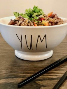 Don't order Chinese takeout. Try this pork and mushroom cauliflower fried rice. We've used cauliflower rice to compliment the pork, vegetables, egg and spicy sauce. It's Paleo gluten-free and Whole30 compliant, but mostly it's just delicious! | www.amiofbs