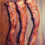 Here is the easiest way to make crispy sheet pan bacon in your oven with no mess. Try it and you'll never go back to standing over the stove. | www.amiofbs.com