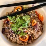 Don't order Chinese takeout. Try this pork and mushroom cauliflower fried rice. We've used cauliflower rice to compliment the pork, vegetables, egg and spicy sauce. It's Paleo gluten-free and Whole30 compliant, but mostly it's just delicious! | www.amiofbs.com