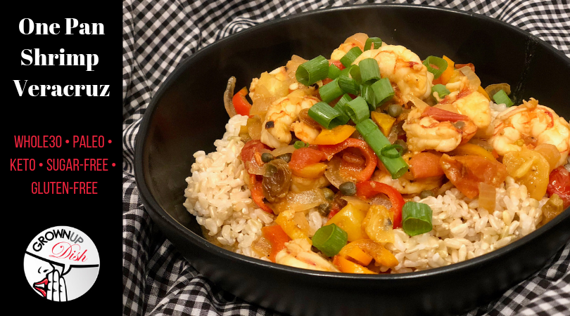 This One Pan Shrimp Veracruz recipe is spicy, saucy, seafood perfection. It's a delicious mixture of tomatoes and two kinds of peppers (baby sweet bell peppers and Jalapeno) with an added flavor pop from capers and a little sweetness from golden raisins. I know it sounds like a weird list of ingredients, but trust me, it's the bomb dot com. And it's paleo, keto, gluten-free, sugar-free and Whole30 compliant. | www.amiofbs.com