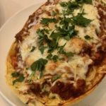 This gluten-free spaghetti squash lasagna recipe will be your new favorite. Tasty spaghetti squash tossed with garlicy greens, cheese & meat sauce. So good! | www.amiofbs.com