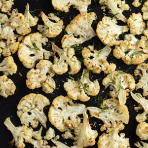 This tumeric roasted cauliflower recipe combines to of today's hottest superfoods. Make it in 30 minutes on a sheet pan - it's ideal for a weeknight dinner. | www.amiofbs.com