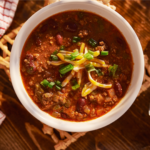 This Veggie Loaded Chili recipe is sugar-free and gluten-free. For Whole30, paleo or keto versions omit the beans. Make a big pot today and thank me later. | www.amiofbs.com