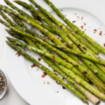 This oven roasted asparagus recipe is quick (20 minutes), easy (4 ingredients), healthy and (most of all) delicious. Vegan, Whole30 and keto - try it today! | www.amiofbs.com