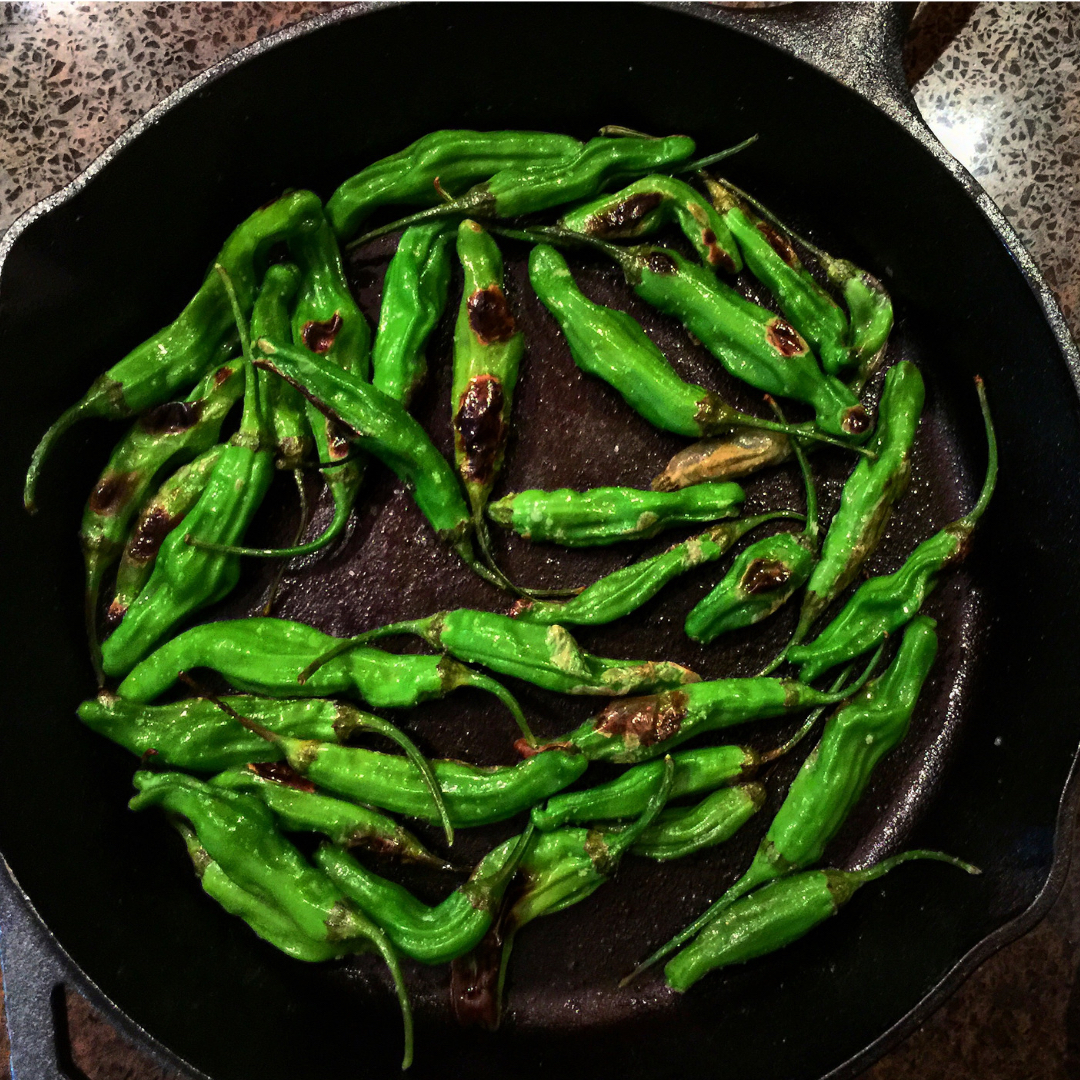 This easy shishito pepper recipe is ready in 5 minutes and uses three ingredients: shishido peppers, olive oil and salt. Couldn't be simpler! | www.amiofbs.com