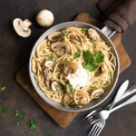 Farmers Market Creamy Mushroom Pasta comes together in 30 minutes and it's restaurant-level deliciousness. Use organic grass-fed dairy and enjoy this vegetarian delight guilt-free. | www.amiofbs.com