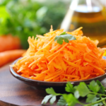 Make this healthy Mexican Carrot Salad with grated carrots, chopped pickled jalapeño peppers, a drizzle of olive oil and cilantro. So crunchy and delicious! | www.amiofbs.com