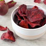 Homemade beet chips have all the crunchy satisfaction of a potato chip with none of the guilt. And they are ridiculously easy to make with this easy recipe. | www.amiofbs.com