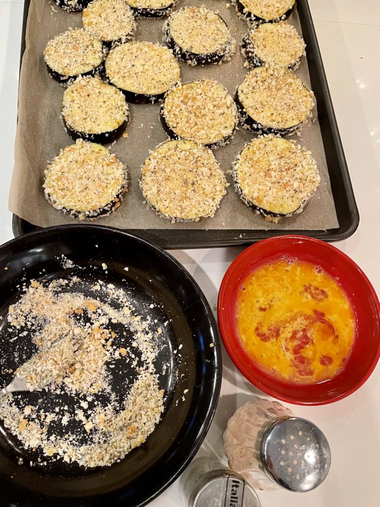Say goodbye to mushy eggplant. This Easy Cheesy Sheet Pan Eggplant Parmesan ensures that every bite is the perfect mix of crunchy, saucy and cheesy goodness! | www.amiofbs.com