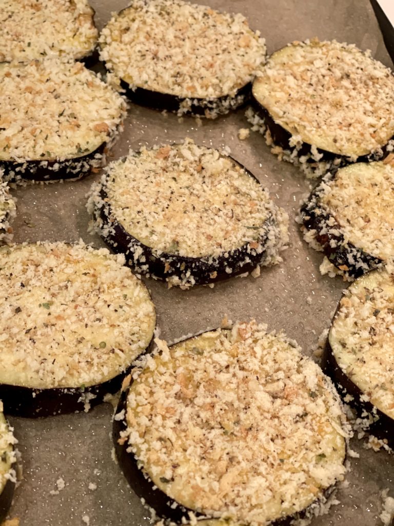Say goodbye to mushy eggplant. This Easy Cheesy Sheet Pan Eggplant Parmesan ensures that every bite is the perfect mix of crunchy, saucy and cheesy goodness! | www.amiofbs.com