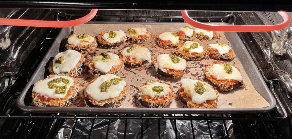 Say goodbye to mushy eggplant. This Easy Cheesy Sheet Pan Eggplant Parmesan ensures that every bite is the perfect mix of crunchy, saucy and cheesy goodness! | www.amiofbs.com