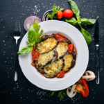 Say goodbye to mushy eggplant. This Easy Cheesy Sheet Pan Eggplant Parmesan ensures that every bite is the perfect mix of crunchy, saucy and cheesy goodness! | www.amiofbs.com