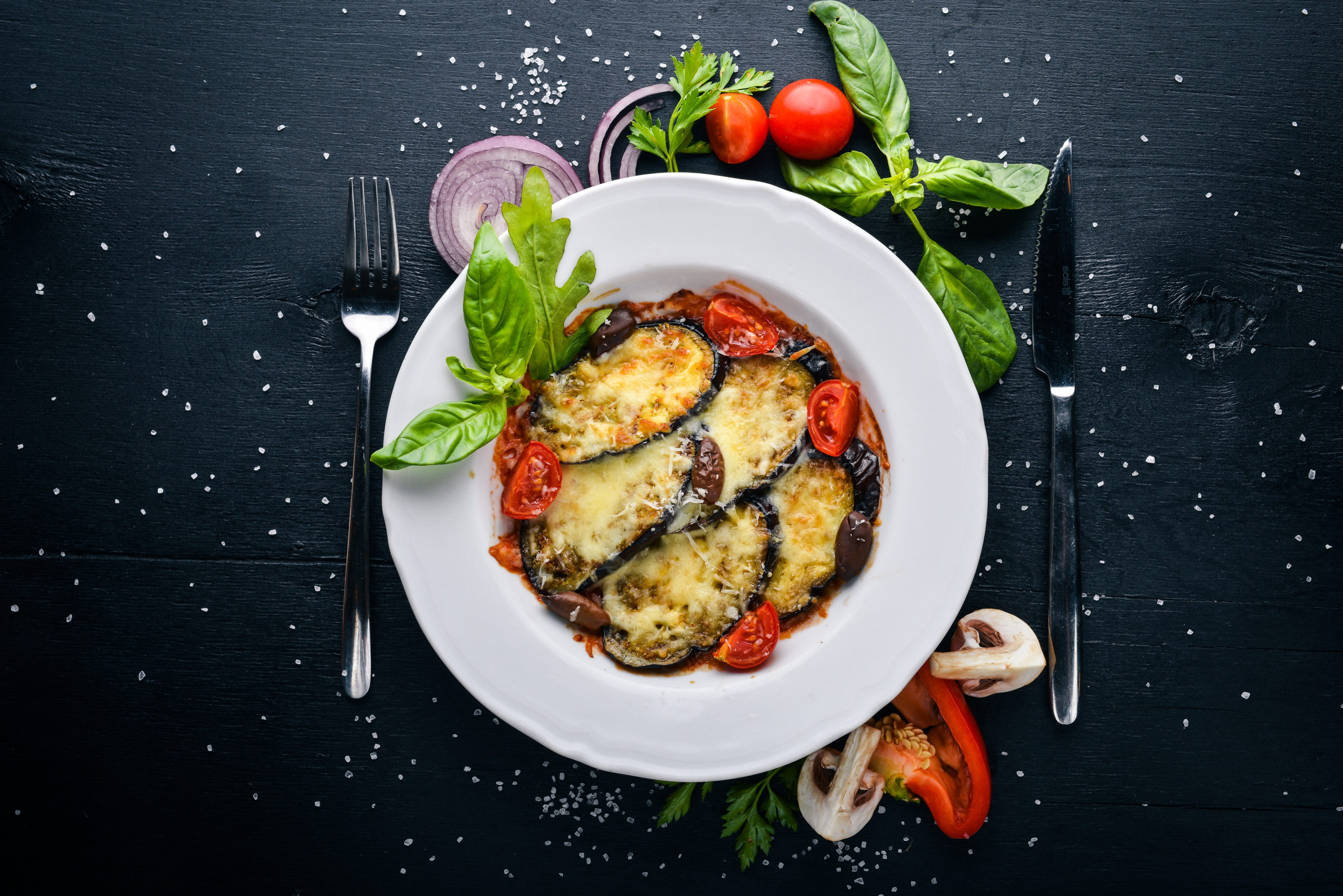 Say goodbye to mushy eggplant. This Easy Cheesy Sheet Pan Eggplant Parmesan ensures that every bite is the perfect mix of crunchy, saucy and cheesy goodness! | www.amiofbs.com