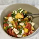 There's a saying that goes "What grows together, goes together." With peaches and tomatoes in season and plentiful, this super simple Peach and Tomato Caprese Salad is a lovely way to enjoy them. | www.amiofbs.com