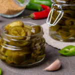 Discover how to make Sugar-Free Candied Jalapeños using no calorie monkfruit sweetener instead of sugar. They're sweet and spicy and virtually indistinguishable from the store-bought version. | www.amiofbs