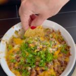 Easy Cheesy Blackeyed Pea dip is easy to make, delicious and sure to bring you lots of good luck in the new year. You've got to try it! | www.amiofbs.com