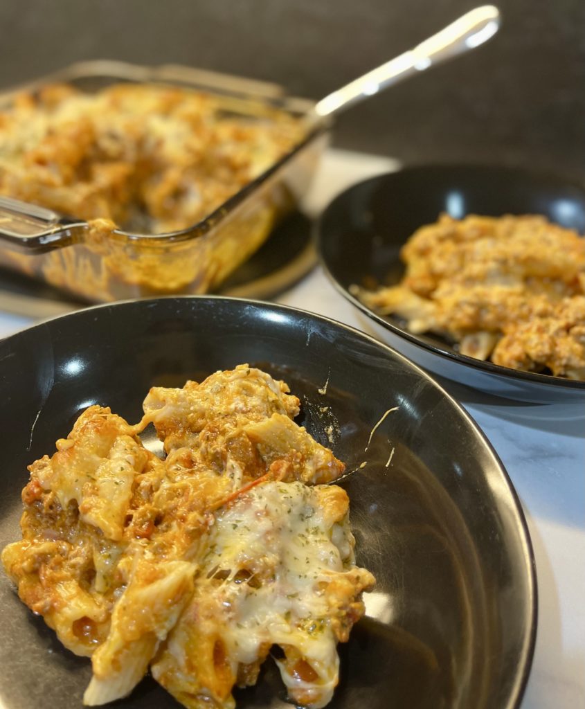 This quick and easy baked ziti recipe uses jarred pasta sauce so you can get dinner on the table in just over 30 minutes. Can be made gluten free. | www.amiofbs.com