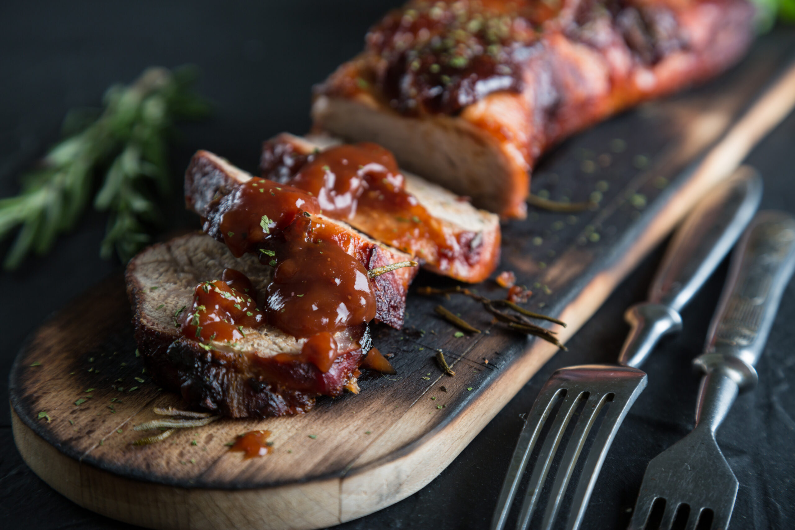 Pork Tenderloin with Maple Garlic Sauce is seasoned, seared and baked in a mouthwatering sauce until it’s sticky on the outside and juicy on the inside. | www.amiofbs.com