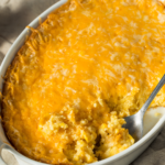 This easy cheesy corn casserole is a no fail recipe that’s perfect for the holidays but easy enough for a weeknight dinner. You've got to try it. | www.amiofbs.com