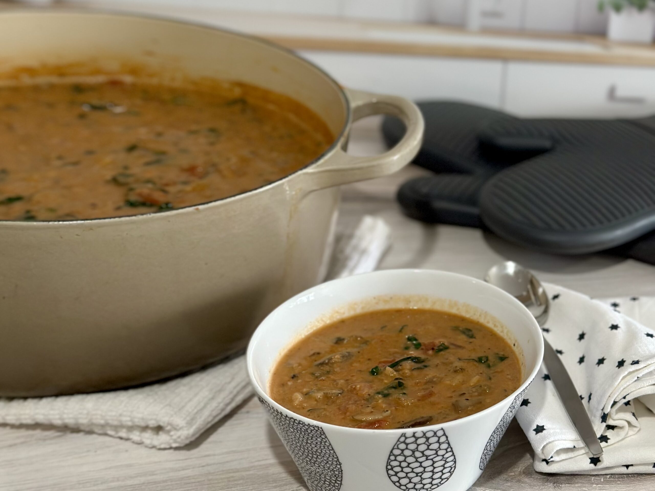 Creamy mushroom and kale soup is vegetarian comfort food. It's so rich and hearty! Serve it as soup or ladle it over polenta or mashed potatoes. | www.amiofbs.com
