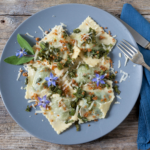 Creamy ravioli with spring vegetables is a delicious vegetarian recipe. It's a healthy easy meal packed with flavor and nutrients. | www.amiofbs.com